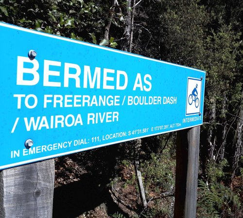 Bermed as | Sign on a mtb trail